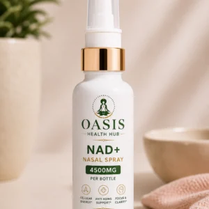 NAD+ nasal spray bottle on table.